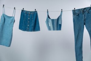 blue denim shorts hanged on white clothes hanger